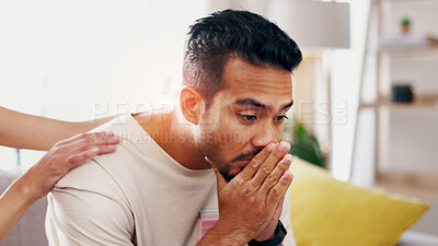 Buy stock photo Hands, support and man with grief in home, heartbroken or thinking of divorce on sofa in living room. Comfort, help and person with depression after separation, reflection and sad memories in house