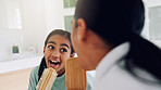 Mom, girl and singing with brush in bathroom for fun grooming or spa day together in home. Mother, child or bonding with vibe, haircare or playful karaoke for beauty, love or salon treatment in house