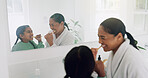Mom, girl and brushing with teeth in bathroom for dental hygiene, grooming or cleaning together. Mother, child or playful daughter with smile, mirror or reflection for oral, mouth or gum care in home