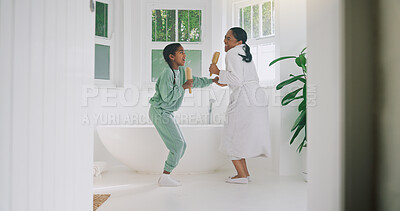 Buy stock photo Mom, child and singing with brush in bathroom for fun grooming or spa day together in home. Mother, girl or dancing with vibe, haircare or playful karaoke for beauty, love or morning routine in house