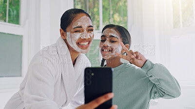 Buy stock photo Happy mom, child and peace sign with face mask for selfie, social media post or spa day together. Mother, girl or daughter with smile, facial treatment or app for morning routine or picture in home