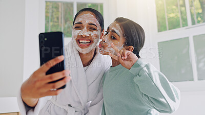 Buy stock photo Happy mom, girl and peace sign with face mask for selfie, social media post or spa day together. Mother, child or daughter with smile, facial treatment or app for morning routine or picture in home