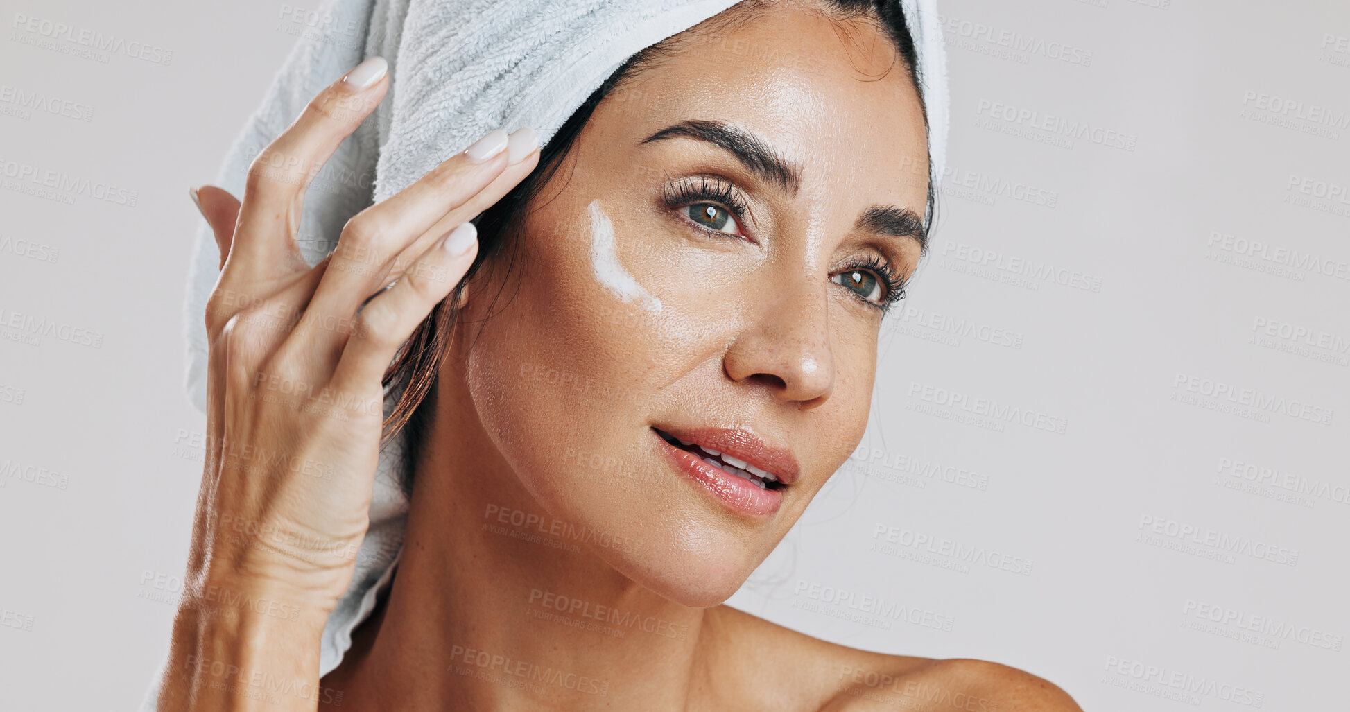 Buy stock photo Skincare, thinking and woman with moisturizer in studio, apply retinol cream and anti aging treatment. Beauty, reflection and mature person with lotion for hydration, glowing skin or white background