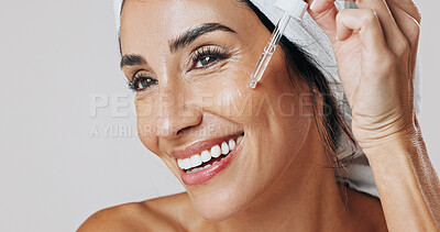Buy stock photo Skincare, thinking and woman with dropper in studio, hyaluronic acid treatment and anti aging serum. Smile, dermatology or mature person apply product for glowing skin, reflection or white background