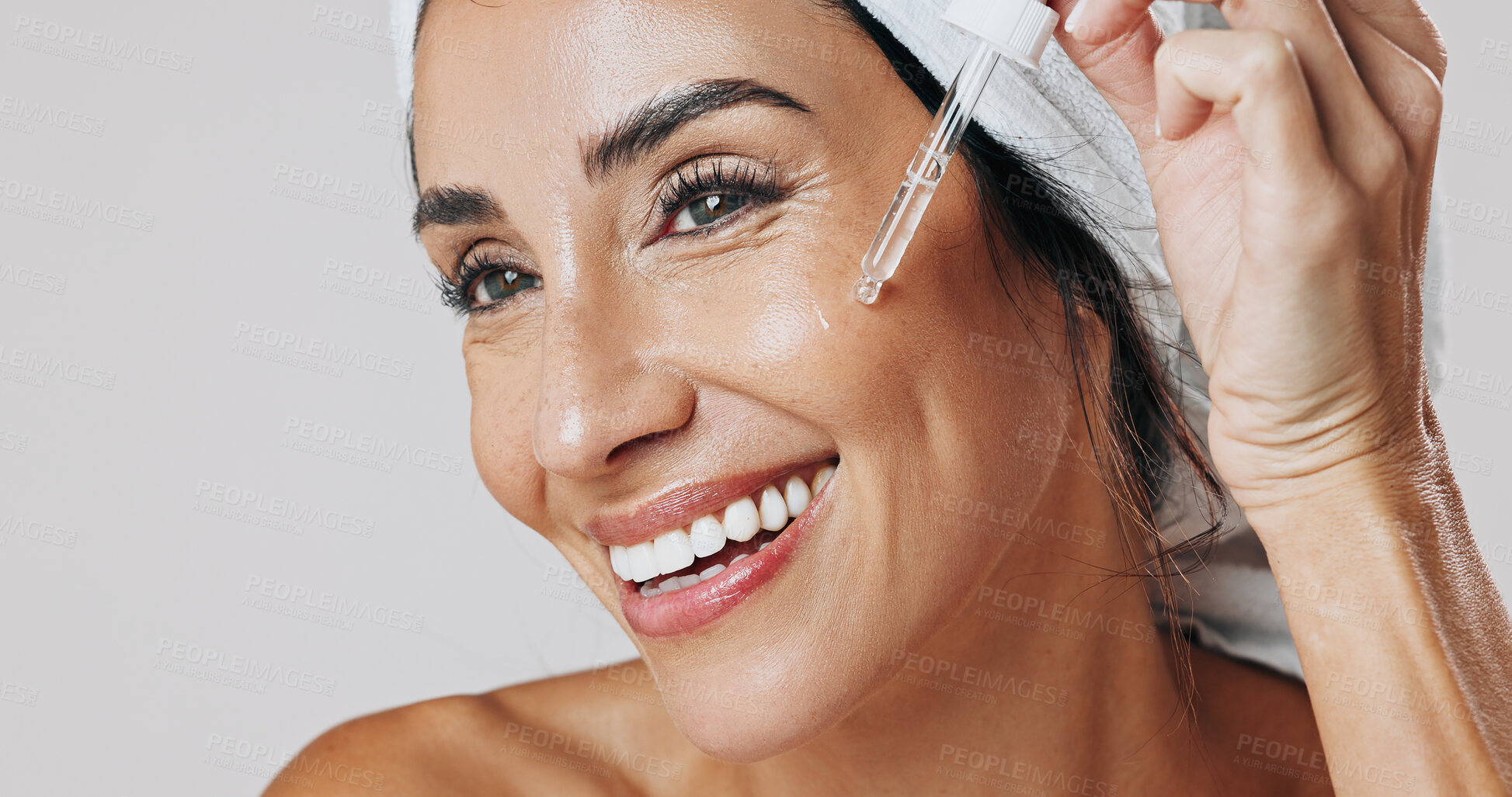 Buy stock photo Skincare, thinking and woman with dropper in studio, hyaluronic acid treatment and anti aging serum. Smile, dermatology or mature person apply product for glowing skin, reflection or white background
