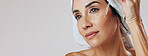 Skincare, thinking or mature woman with dropper in studio, apply hyaluronic acid or anti aging treatment. Banner, vision or person with hydration serum for skin glow, mockup space or white background
