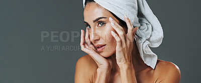 Buy stock photo Glow, woman and skincare in studio for anti aging, banner and aesthetic in dermatology. Mature person, treatment and towel with cosmetology, beauty or cosmetics with space on gray background