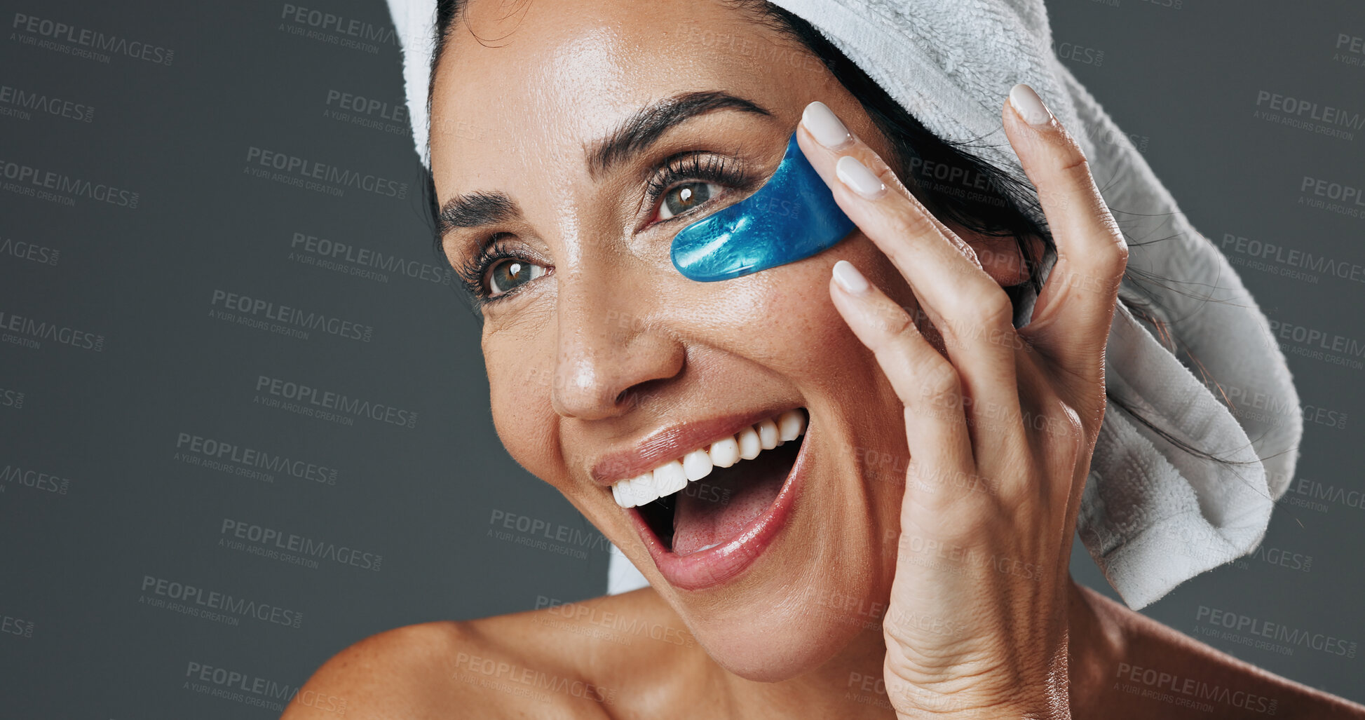 Buy stock photo Happy woman, studio and skincare with eye patch for collagen or detox on a gray background. Female person, model or smile with mask or facial treatment for beauty cosmetics, anti aging or hydration