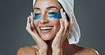 Happy woman, studio and skincare with eye patches for collagen or detox on a gray background. Female person, model or smile with mask or facial treatment for beauty cosmetics, anti aging or hydration