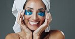 Skincare, portrait or woman with eye mask in studio, dark circles reduction or anti aging treatment. Beauty, smile or mature person with collagen patches for hydration, self care or gray background