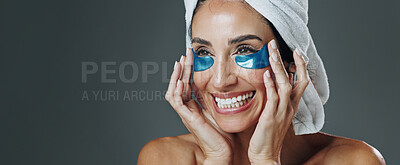 Buy stock photo Happy woman, studio or banner with eye patches for skincare or collagen on a gray background. Female person, model or smile with mask or facial for beauty cosmetics, anti aging or hydration on space