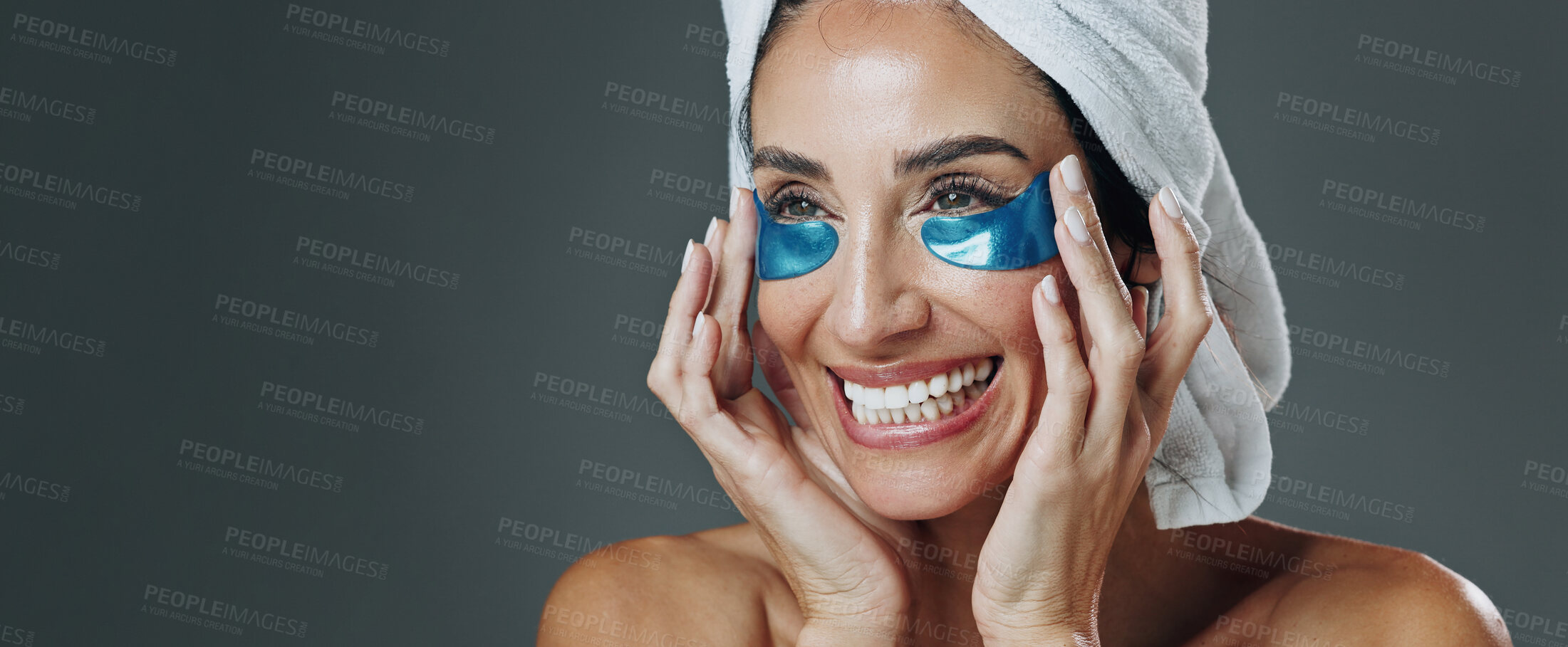 Buy stock photo Happy woman, studio or banner with eye patches for skincare or collagen on a gray background. Female person, model or smile with mask or facial for beauty cosmetics, anti aging or hydration on space