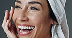 Happy, woman and skincare in studio for anti aging, confidence and aesthetic in dermatology. Mature person, treatment and towel with cosmetology, beauty or cosmetics with glow on gray background