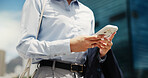 Business, woman and hands typing with phone in city for communication, network or connection. Female person, employee or texting with mobile smartphone or app for online chat or social media in town