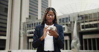 Buy stock photo Business, smartphone and black woman in city, typing or email for investment deal, social media or internet. Scroll, economy website or person in street, risk management or cellphone for trading info