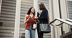 Businesswoman, smartphone and share in city, together and happy with chat for networking on commute. People, outdoor and social media with phone, mobile app or talk in low angle on trip in urban town