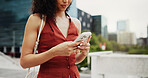 Woman, hands and typing with phone in city for communication, social media or network. Female person, travel or texting with mobile smartphone or app for connection, business or chat in an urban town
