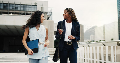 Buy stock photo Businesswoman, happy and friends in city on walk, commute and excited for property management career. People, team and real estate agent with partner, gossip and funny story with trip in urban town
