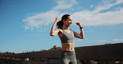 Buy stock photo Athlete, woman and running celebration in city for fitness goals, cardio pace target and victory. Space, runner and excited with fist pump on bridge for exercise success, health progress and wellness