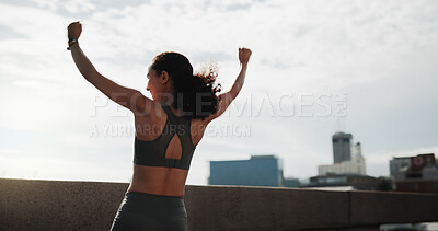 Buy stock photo Athlete, woman and fitness celebration in city for running goal, cardio pace target and milestone. Space, back and runner with fist pump on bridge for exercise success, health progress or achievement