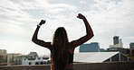 Runner, woman and fitness celebration in city for running goal, cardio pace target and milestone. Active, back or athlete with fist pump on bridge for exercise success, health progress or achievement