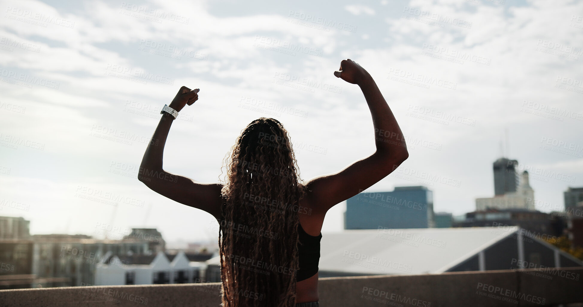 Buy stock photo Runner, woman and fitness celebration in city for running goal, cardio pace target and milestone. Active, back or athlete with fist pump on bridge for exercise success, health progress or achievement