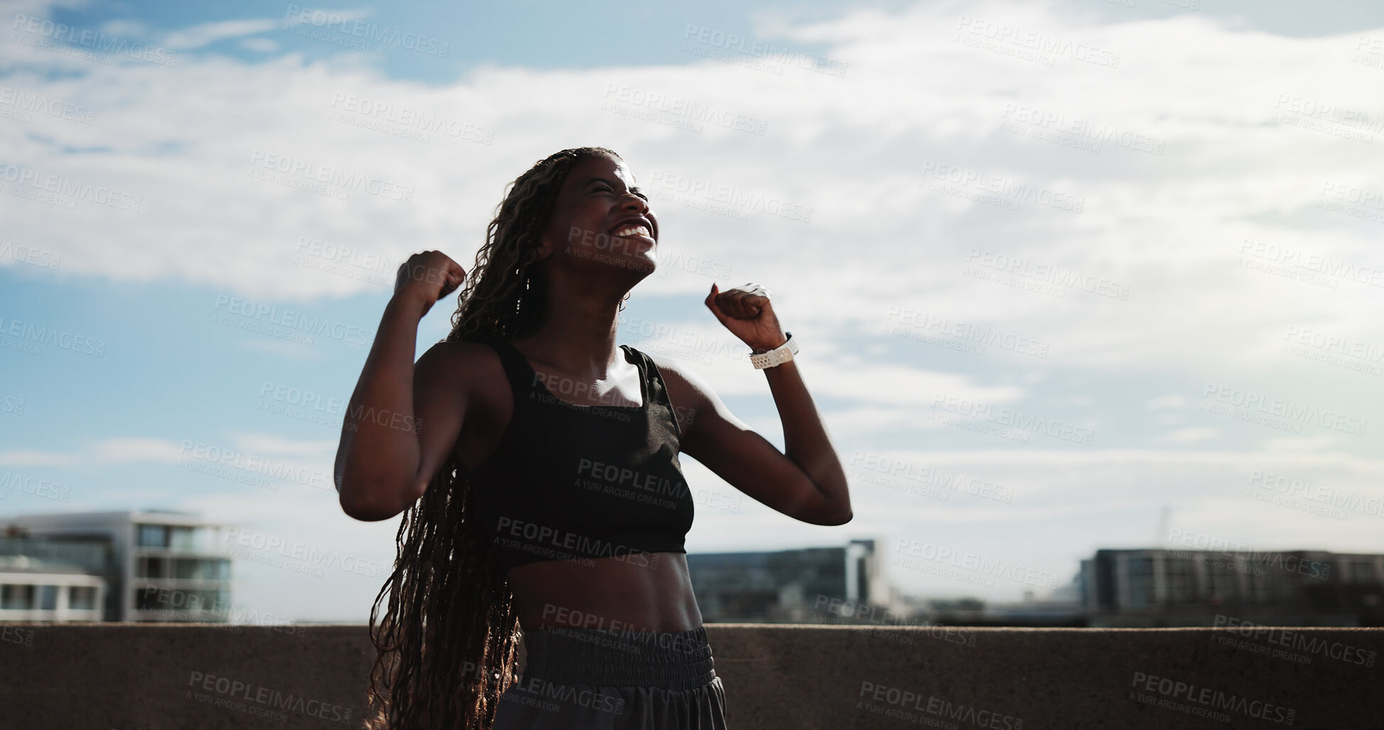 Buy stock photo Excited, woman and fitness celebration in city for running goal, cardio achievement or milestone. Black person, athlete and fist pump outdoor for exercise target, workout victory or wellness on space