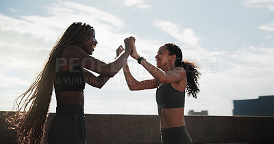 Buy stock photo Athlete, women or excited with high five in city for fitness goals, marathon pace target or wellness. Happy, friends or runners with celebration on bridge for cardio success, race victory and support