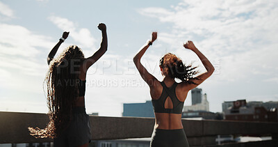Buy stock photo Fitness, back or friends with arms raised, success or celebration together in physical activity. Teamwork, exercise or women in city with victory, achievement or milestone reach in sports workout.