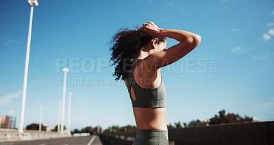 Buy stock photo City road, woman and tie hair for fitness routine, workout preparation and endurance training for wellness. Outdoor, getting ready and runner with commitment for health, cardio and exercise hairstyle