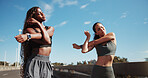 Friends, stretching and women in city for fitness, training and warm up for workout with blue sky. Sports, runner and people ready for wellness, exercise and mobility for active hobby together