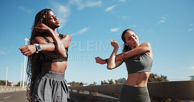 Buy stock photo Friends, stretching and women in city for fitness, training and warm up for workout with blue sky. Sports, runner and people ready for wellness, exercise and mobility for active hobby together