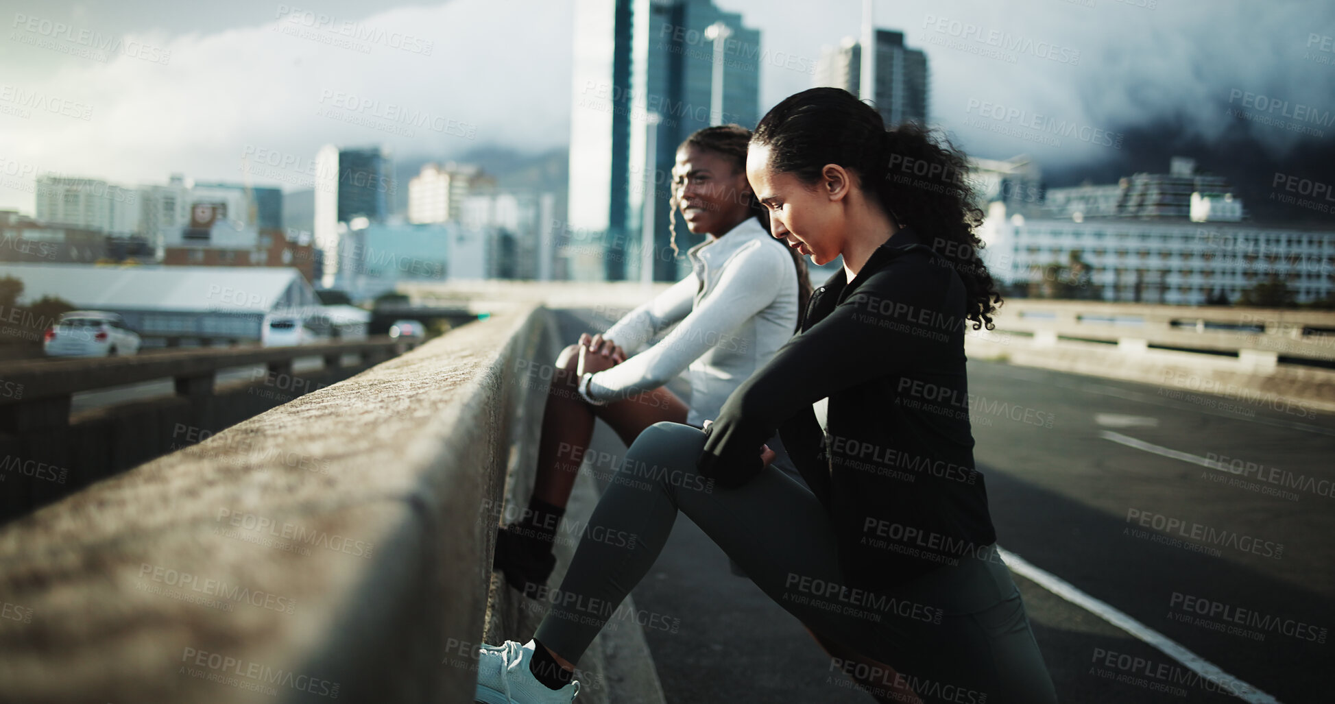 Buy stock photo Women, friends and stretching for fitness, warm up and routine for outdoor training on street. City bridge, chat and people with leg exercise for health, endurance or marathon practice together