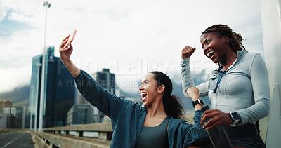 Buy stock photo Exercise, friends and fist pump in city for selfie, cardio workout or social media post on bridge. Women, overcast or runners celebrate wellness, win and urban photography outdoor with energy