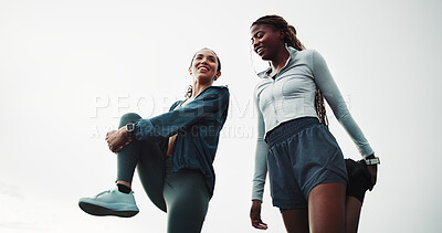 Buy stock photo Women, friends and stretching for fitness, warm up and routine for outdoor training with smile. Low angle, getting ready and people with leg exercise for health, endurance or start practice together