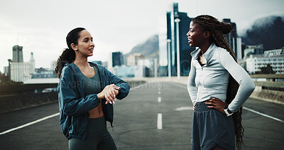 Buy stock photo Happy, time and women in city for fitness, cardio workout or support on bridge. Female people, watch timer or personal trainer with training for wellness, sports and exercise outdoor on urban street