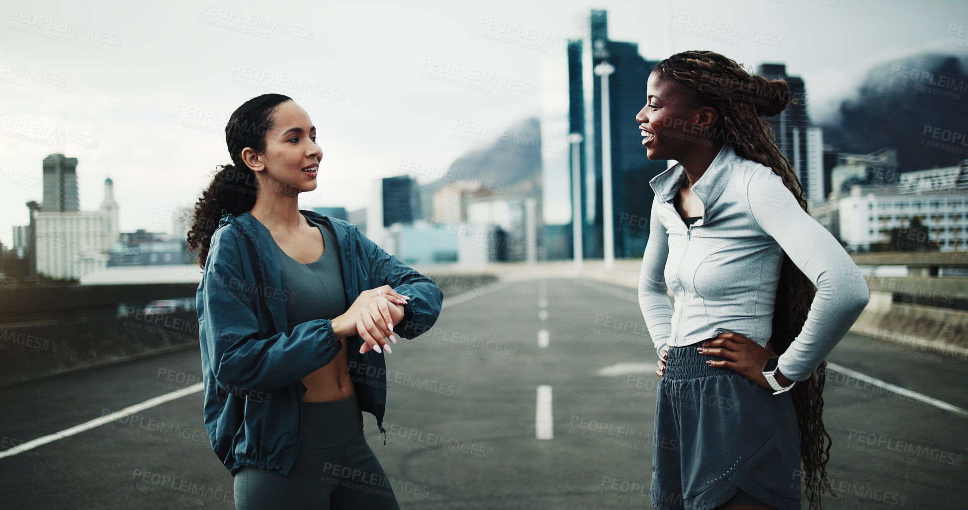 Buy stock photo Happy, time and women in city for fitness, cardio workout or support on bridge. Female people, watch timer or personal trainer with training for wellness, sports and exercise outdoor on urban street
