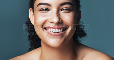 Buy stock photo Portrait, skincare and beauty with happy woman, glow and shine with dermatology on blue background. Cosmetics, smile and person with aesthetic in studio, natural and wellness with healthy skin