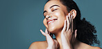 Skincare, touch and woman with smile for beauty, wellness glow aesthetic and smooth texture for space. Facial shine, dermatology or person with happiness for soft skin, self care or studio background
