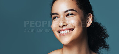 Buy stock photo Skincare, thinking and woman with space in studio for cosmetics, makeup and dermatology. Mockup, happy and person with idea for beauty, salon and facial treatment for wellness on blue background
