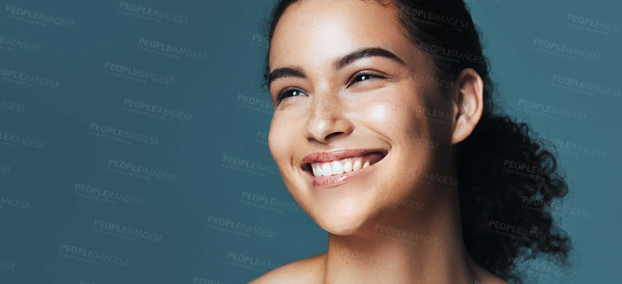 Buy stock photo Skincare, thinking and woman with space in studio for cosmetics, makeup and dermatology. Mockup, happy and person with idea for beauty, salon and facial treatment for wellness on blue background