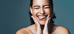 Skincare, silly and woman with space in studio for cosmetics, makeup and dermatology. Mockup, happy and person with tongue out for beauty, salon and facial treatment for wellness on blue background