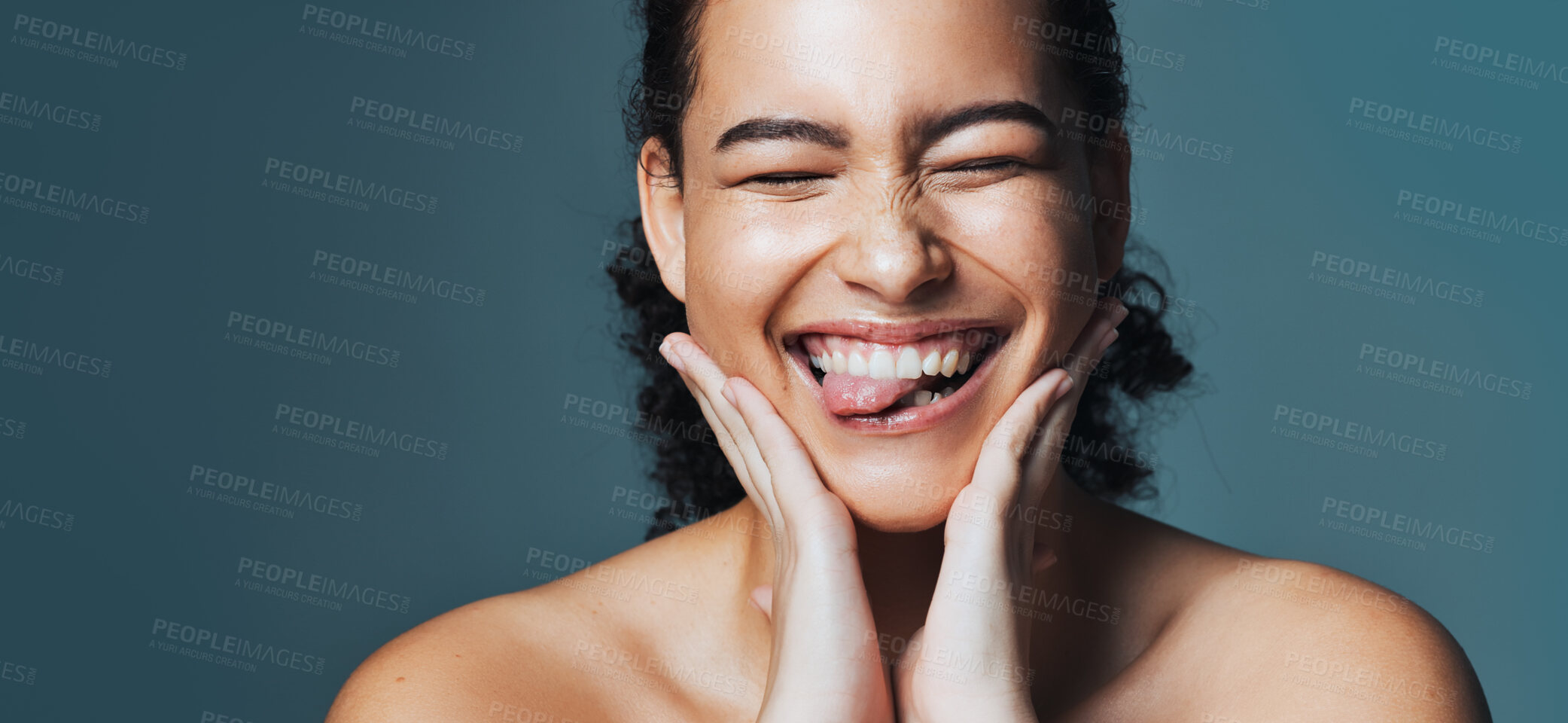 Buy stock photo Skincare, silly and woman with space in studio for cosmetics, makeup and dermatology. Mockup, happy and person with tongue out for beauty, salon and facial treatment for wellness on blue background