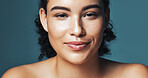 Skincare, smile and portrait of woman in studio for cosmetics, makeup and dermatology. Mockup, happy and person for beauty, salon and facial treatment for wellness, glow and shine on blue background