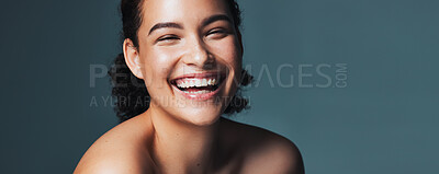 Buy stock photo Skincare, laugh and portrait of woman in studio for cosmetics, makeup and dermatology. Mockup, banner and person for beauty, salon and facial treatment for wellness, glow and happy on blue background