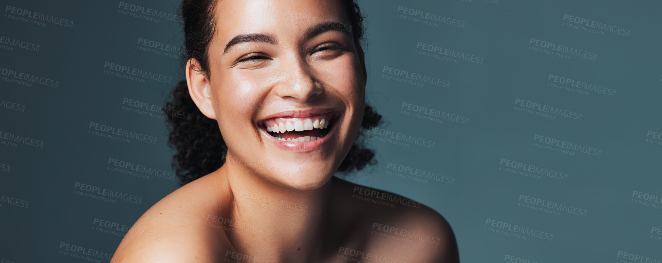 Buy stock photo Skincare, laugh and portrait of woman in studio for cosmetics, makeup and dermatology. Mockup, banner and person for beauty, salon and facial treatment for wellness, glow and happy on blue background