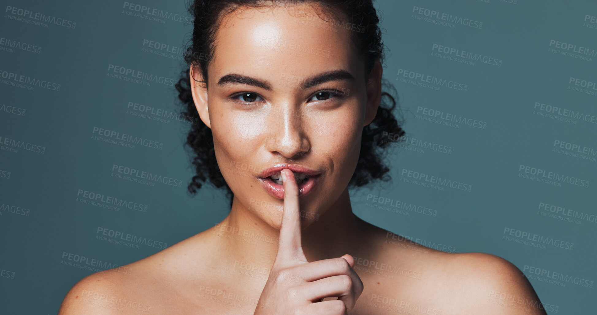 Buy stock photo Secret, skincare and portrait of woman in studio with quiet hand gesture for beauty, glow or health. Natural, happy and female person with finger on mouth for dermatology wellness by gray background.
