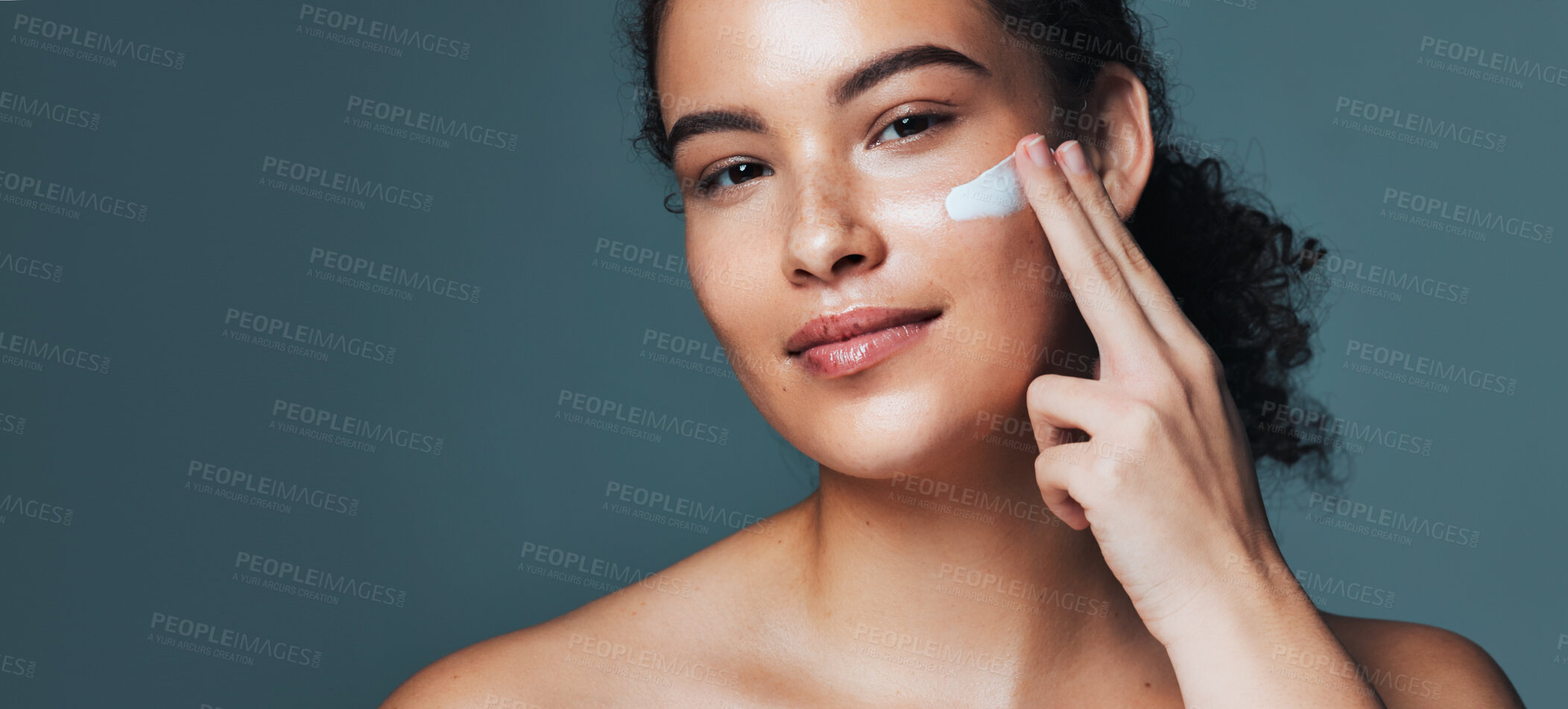 Buy stock photo Face cream, skincare and portrait of woman in studio with beauty, glow or wellness routine. Natural, mockup space and female person with facial lotion for dermatology treatment by gray background.