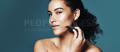 Buy stock photo Portrait, gua sha or woman with skincare for beauty, improve circulation or reduce inflammation for space. Dermatology, natural glow or person with jade crystal stone, banner or studio background
