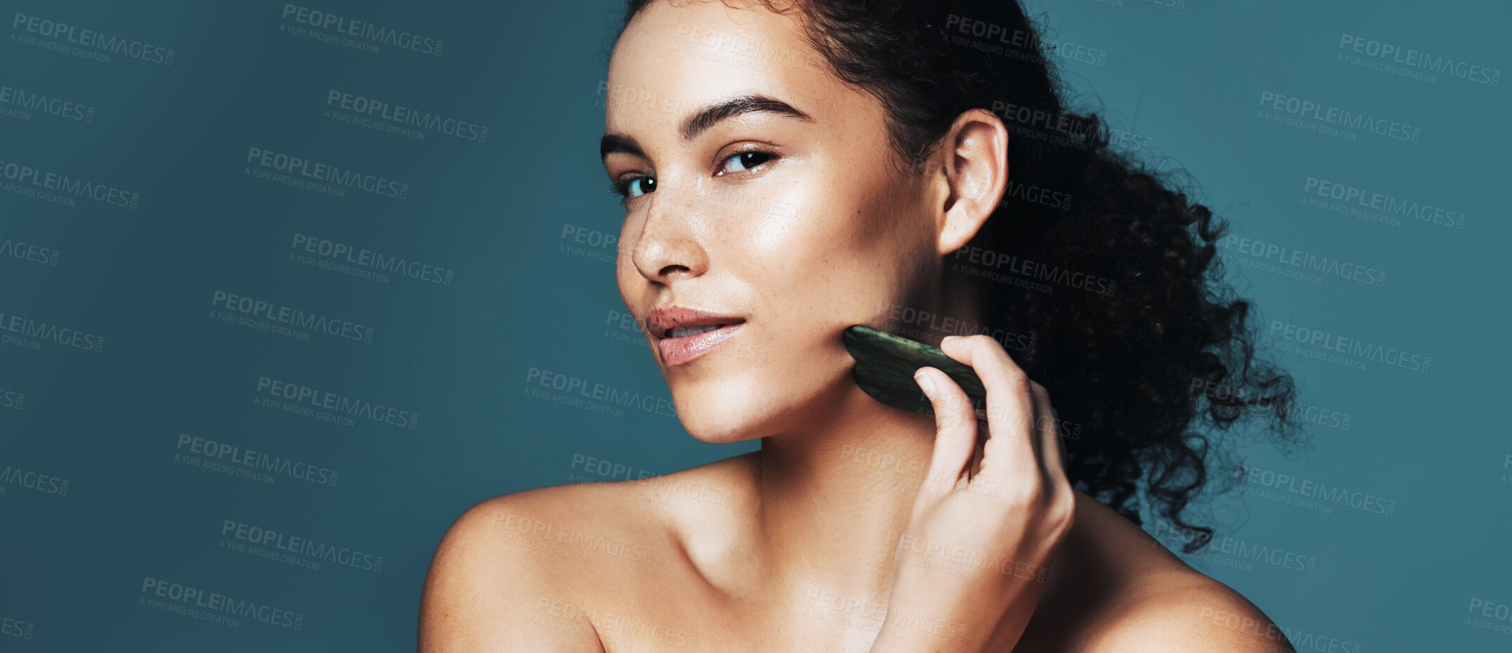 Buy stock photo Portrait, gua sha or woman with skincare for beauty, improve circulation or reduce inflammation for space. Dermatology, natural glow or person with jade crystal stone, banner or studio background